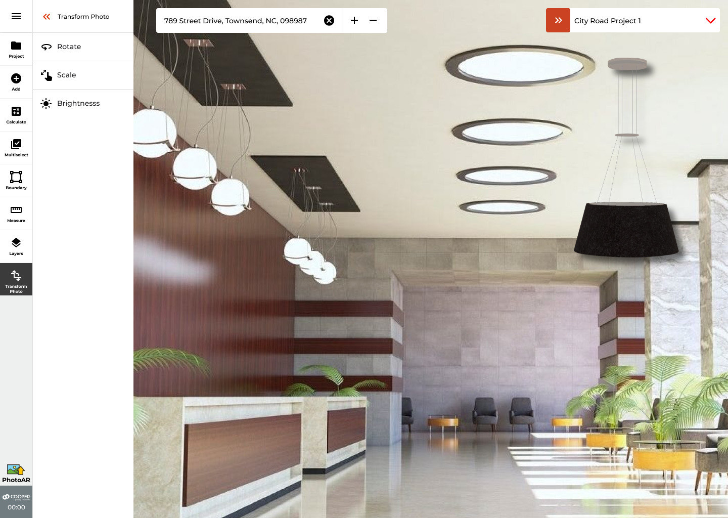 PhotoAR mode placing a virtual pendant luminaire in a photo of a real lobby, with rotate, scale, and brightness controls